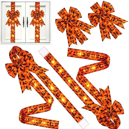 Halloween hair bow with fringe tails on a dark background