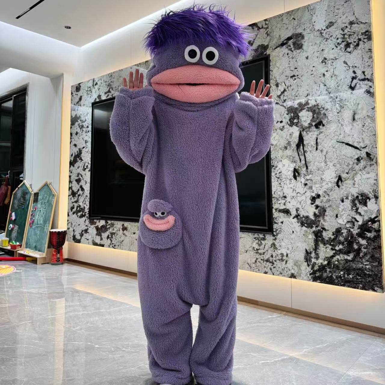 Close-up of the soft plush fleece fabric on the Big Mouth Monster onesie