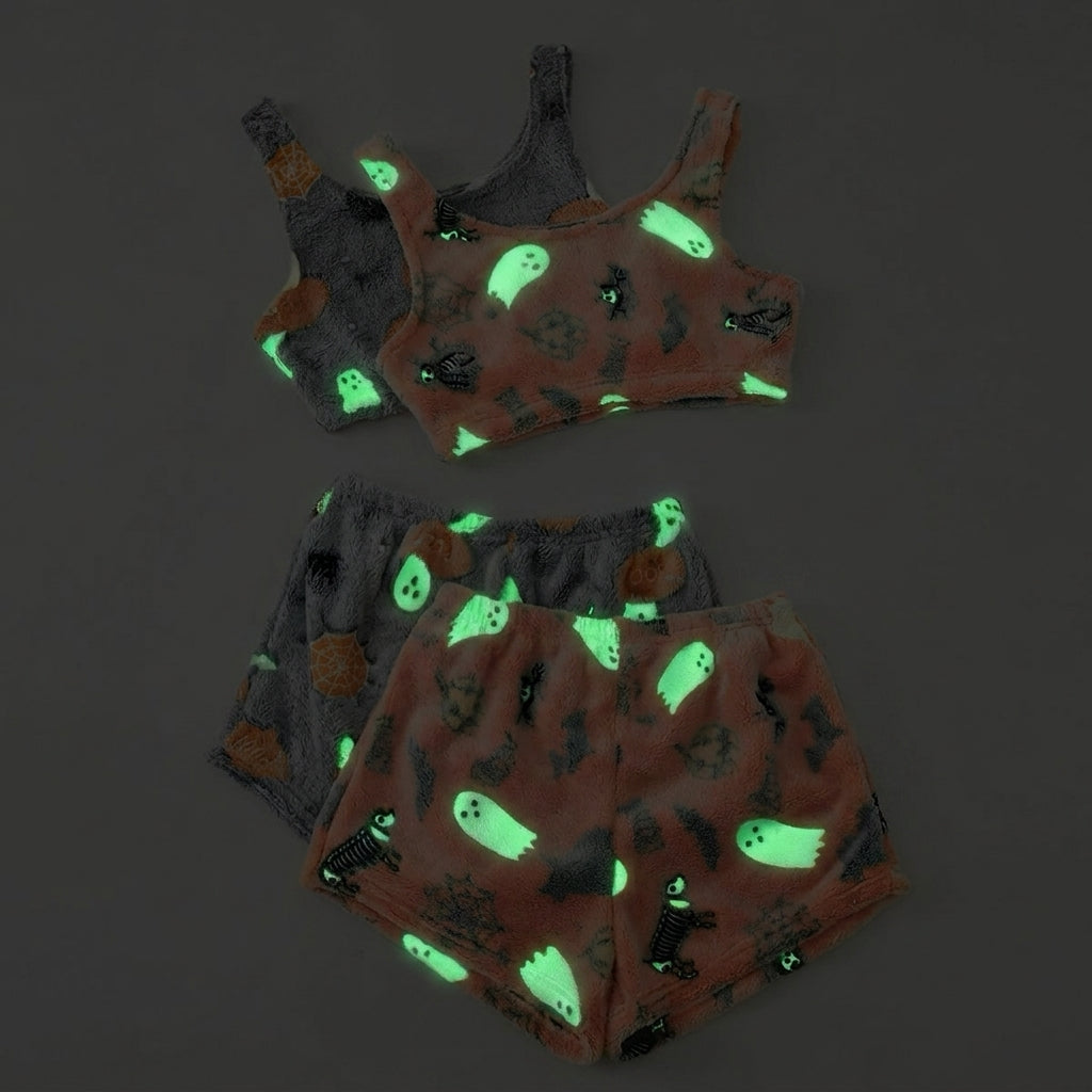 Glow-in-the-dark Halloween pajama sets in coral peach and grey side by side