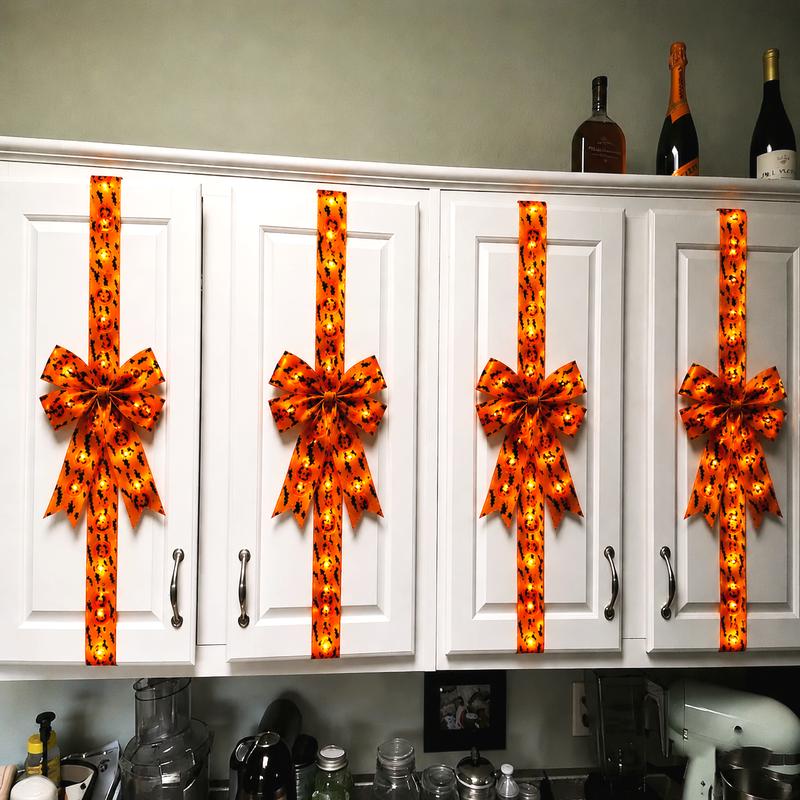 Halloween LED hair bow shown with the lights switched on